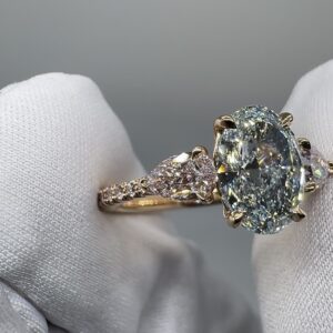 Blue Hour Diamond Ring at an angle, showing the Argyle pink melee shank