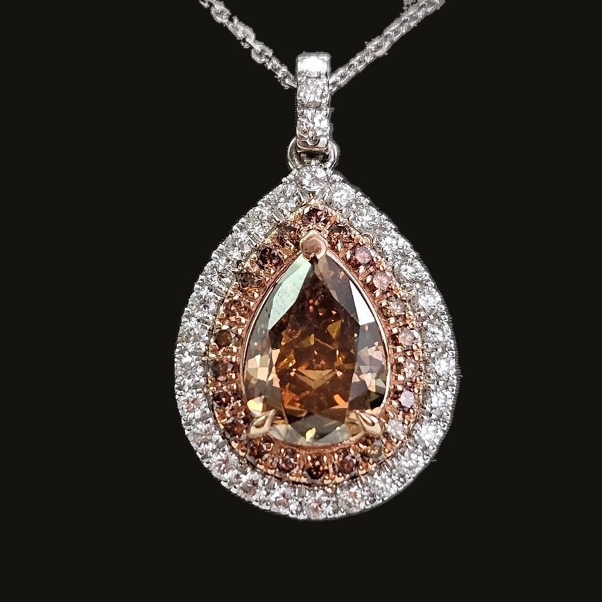 Ember Glow Diamond Pendant: 4.37 carat Fancy Deep Orange Brown pear diamond in a double halo of 14K rose and white gold