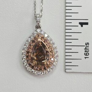 Ember Glow Diamond Pendant beside a ruler for scale