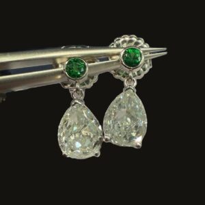 Morning Dew Diamond Drops: two very light yellowish green pear diamonds below round tsavorite garnets, set in platinum
